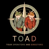TOAD logo — two toads in suits inside a compass-rose badge, over the wordmark TOAD: Tour Operators And Directors